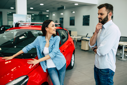 Woman looking at buying a used car