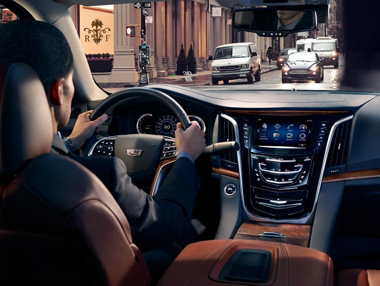 Interior with Man Driving Cadillac 