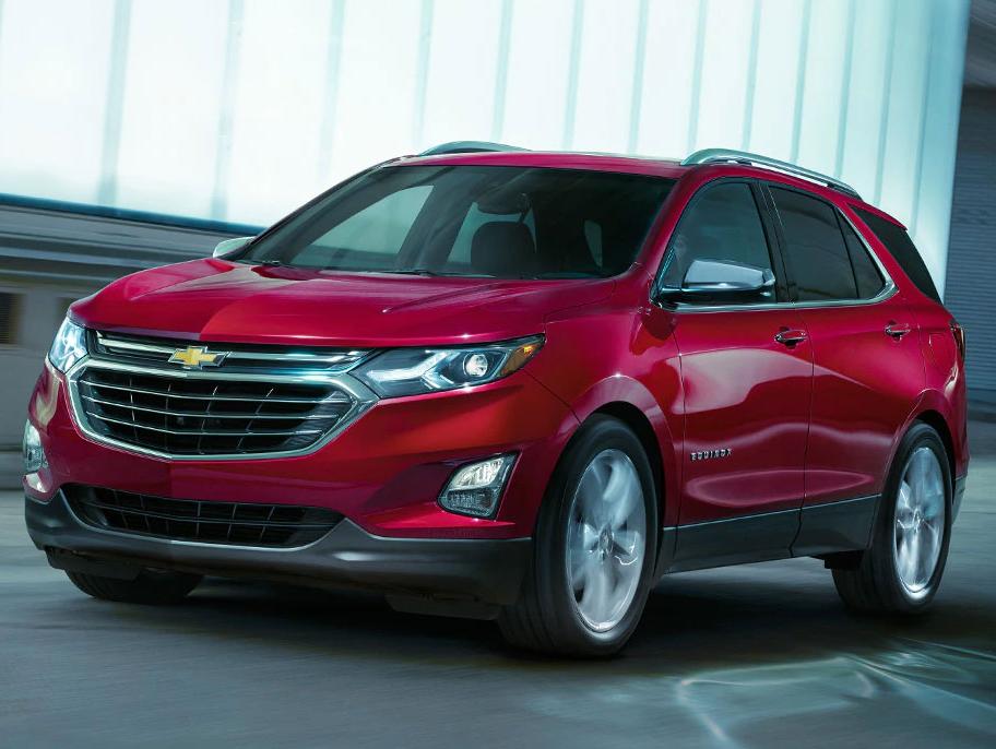 A 2019 Red Chevy Equinox driving in a subway.