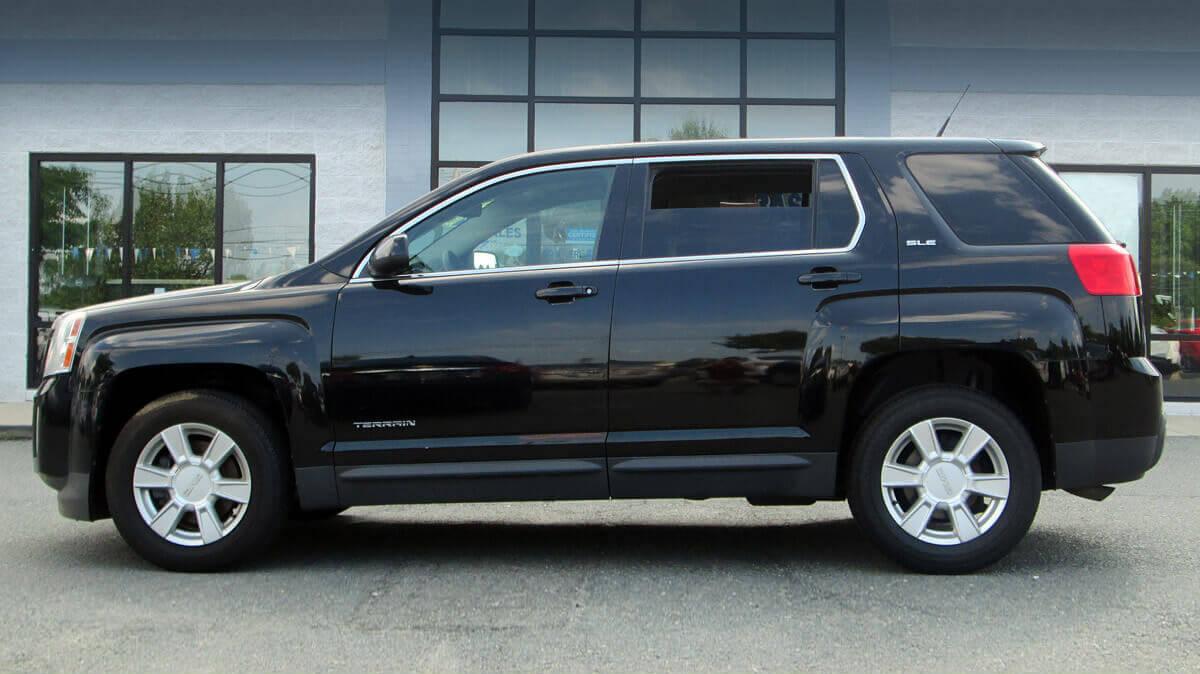 Pre-owned GMC Terrain on a dealership lot.
