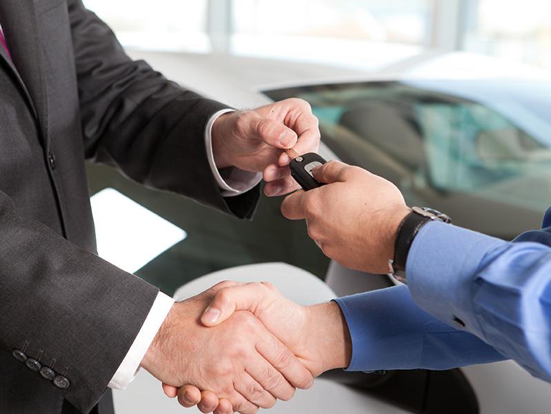 Car Key trading hands at the dealership. 
