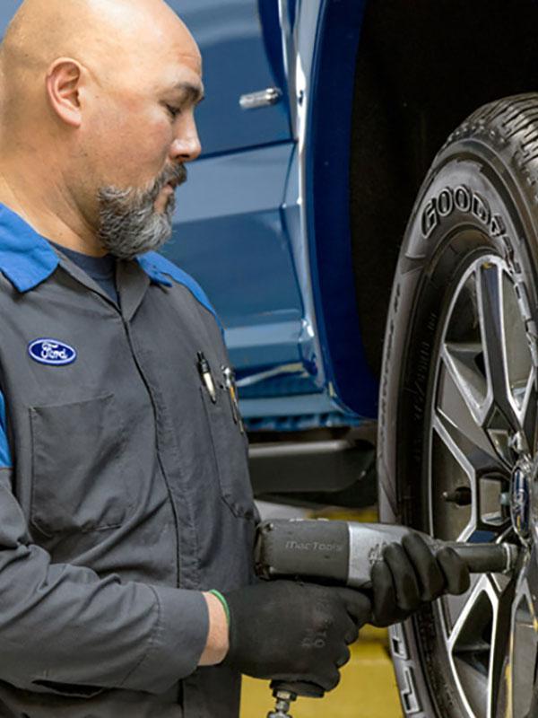 Ford technician working on brakes