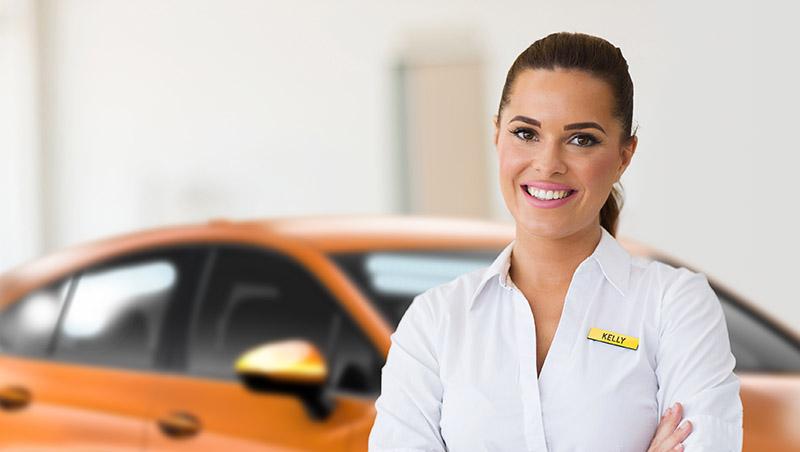 Smiling woman Chevy customer service representative in a dealership.
