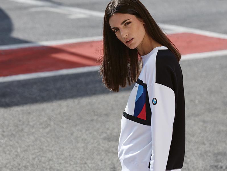 Women modeling BMW M Motorsport crewneck sweater.