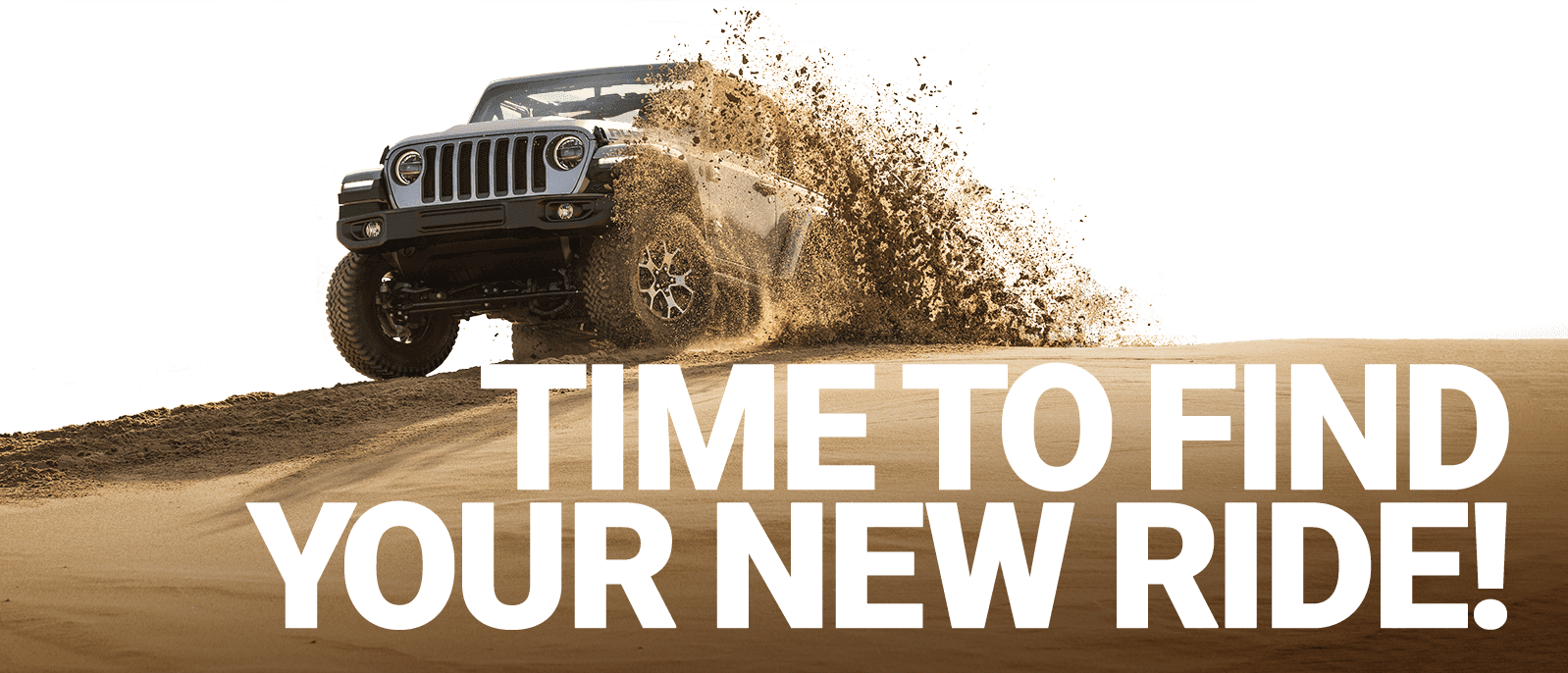 Text; Time to find your new ride. Image; a Jeep Wrangler Rubicon spitting up sand on a dune.