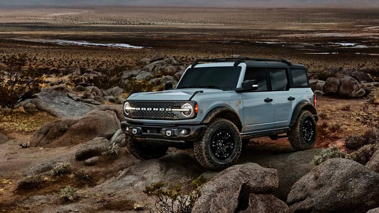 Blue 2021 Ford Bronco parked on a mountain.