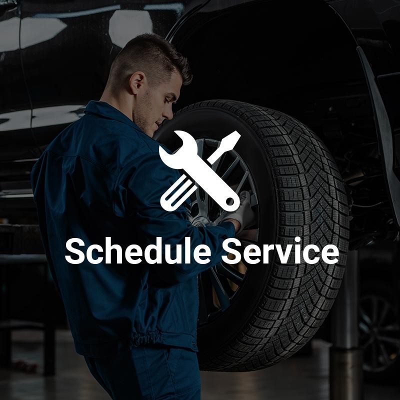 A service Technician repairing tires