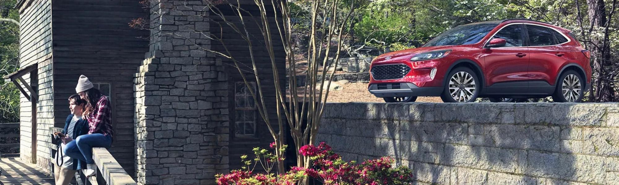 2021 Ford Escape SUV in the woods with 2 people at overlook