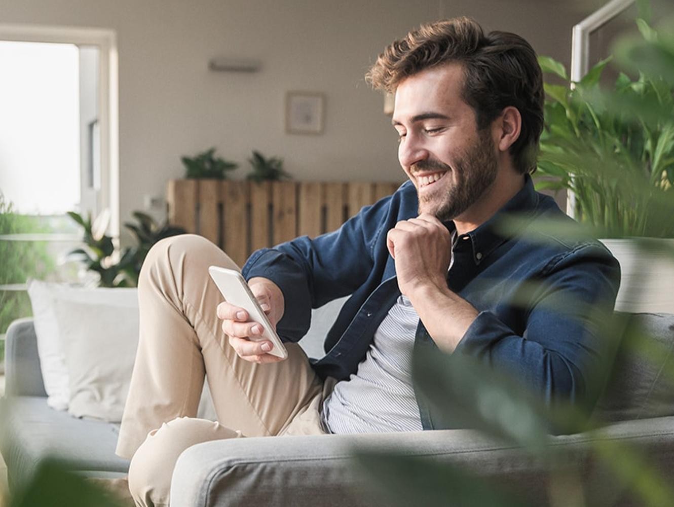 A man scrolling on his phone