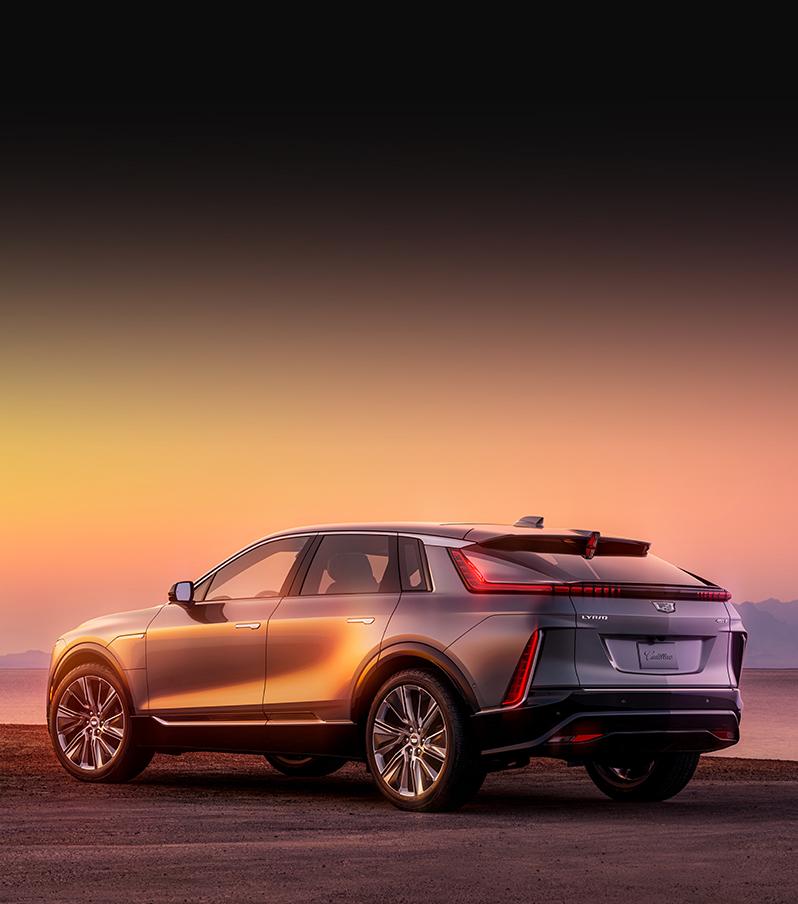 2023 Cadillac Lyriq rear exterior view parked on dirt during sunset