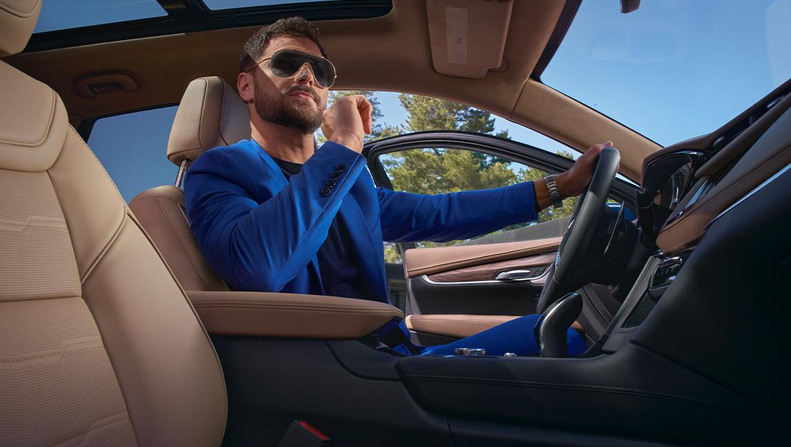 A Man Resting His Elbow On the Luxurious Center Console in the 2024 Cadillac XT5