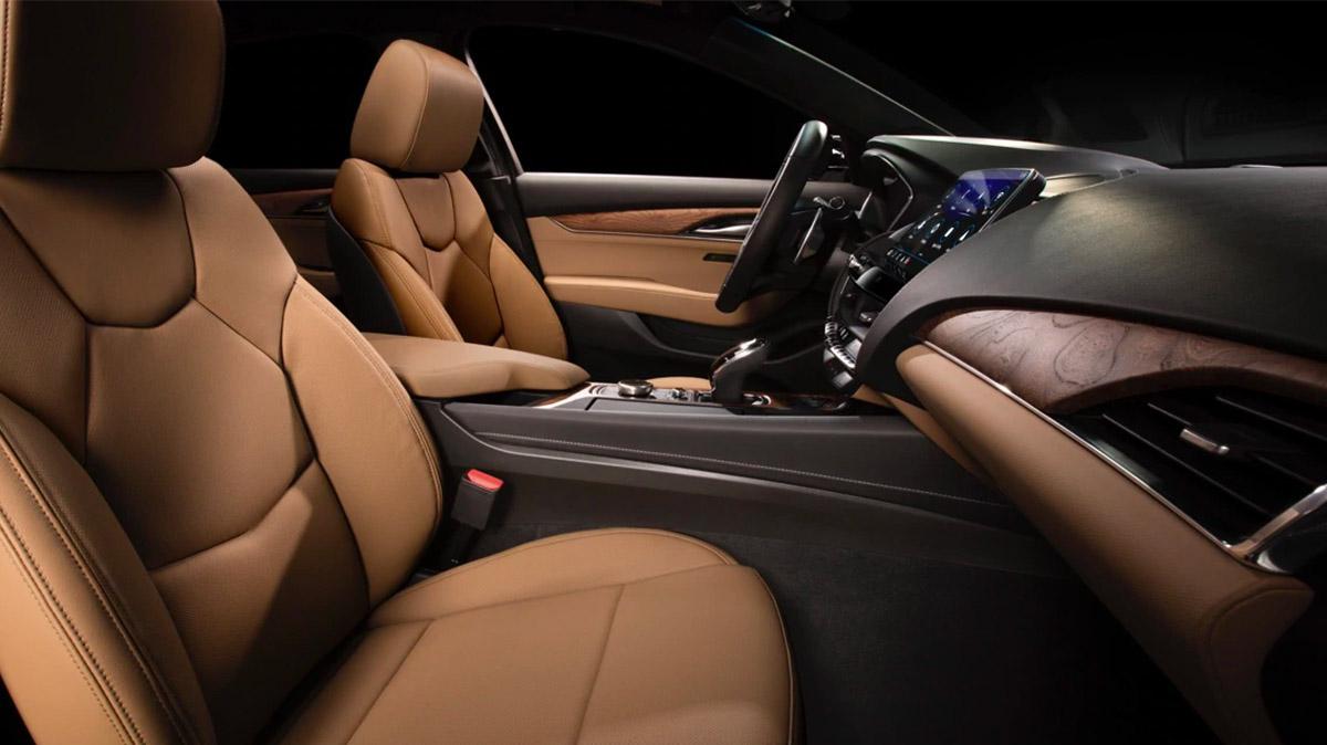Interior cockpit view of the 2020 Cadillac CT5 with wood and leather accents.