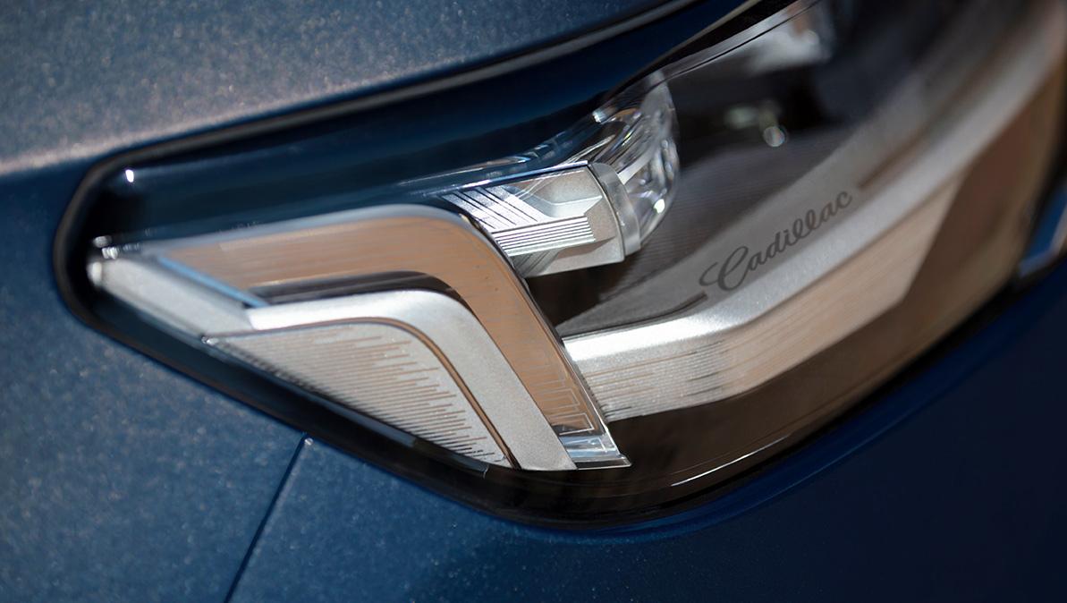 The focus on headlight of 2024 Cadillac Escalade.
