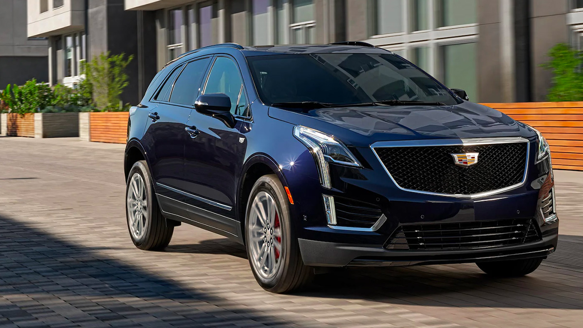 Front view of a black Cadillac XT5 on a street.