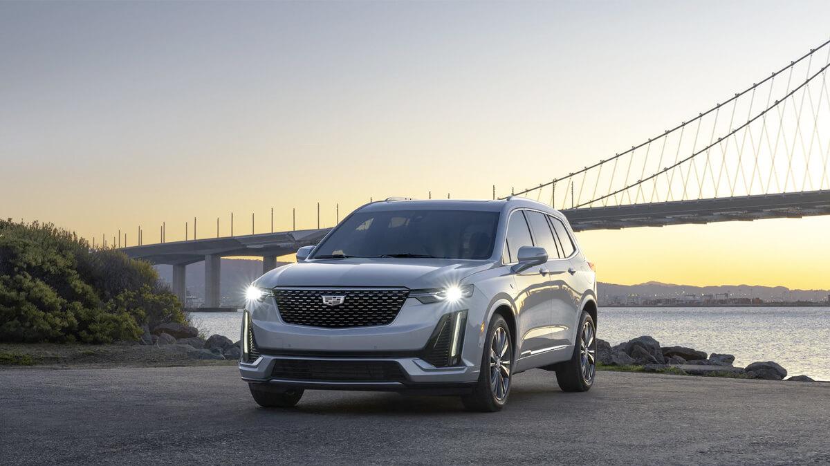 Exterior Shot of 2021 XT6 with Bridge and sunset in background
