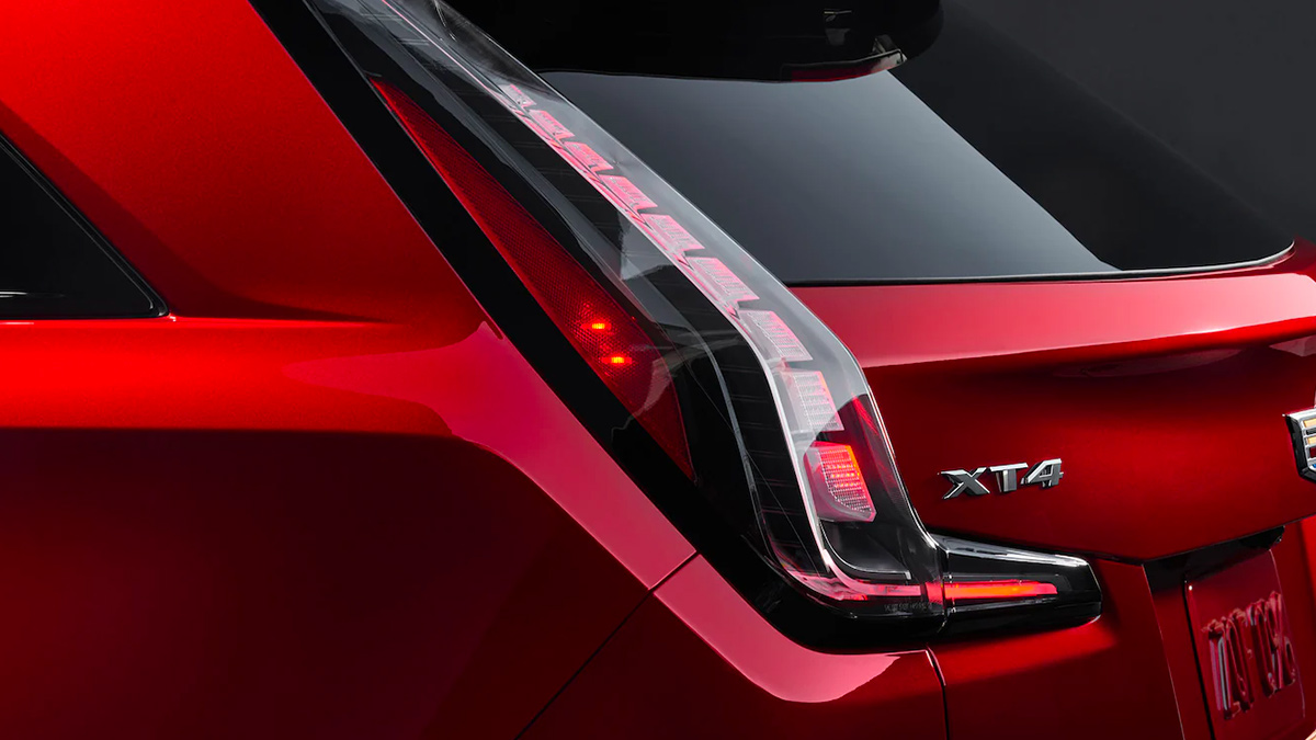 Close-up view of the taillight on a red 2022 Cadillac XT4.