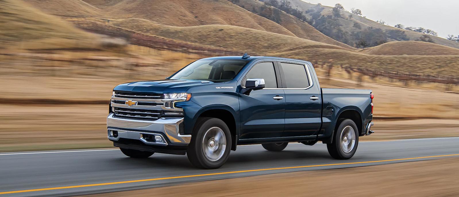 Chevrolet Silverado 1500 LTD driving on the road.