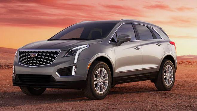 A white 2023 Cadillac XT5 in open area