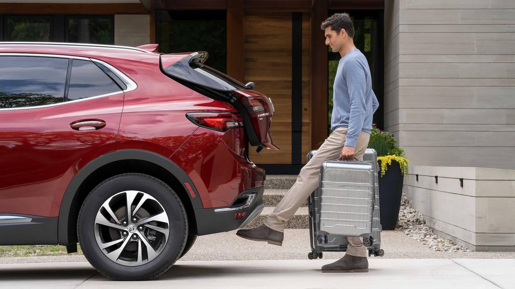 Gentleman accessing 2023 Buick Envision trunk hands free