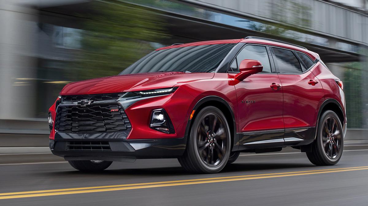 Red 2020 Chevy Blazer driving on a road