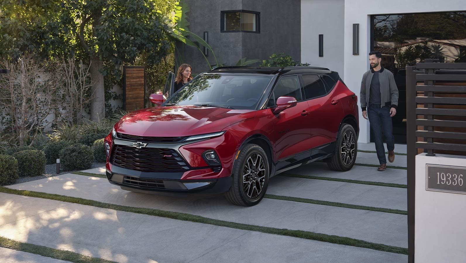 2024 Chevrolet Blazer parked in front of house.