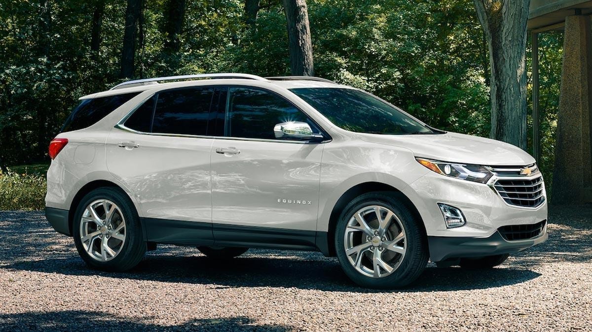 Exterior front 3/4 view of the 2019 Chevy Equinox parked on gravel driveway.