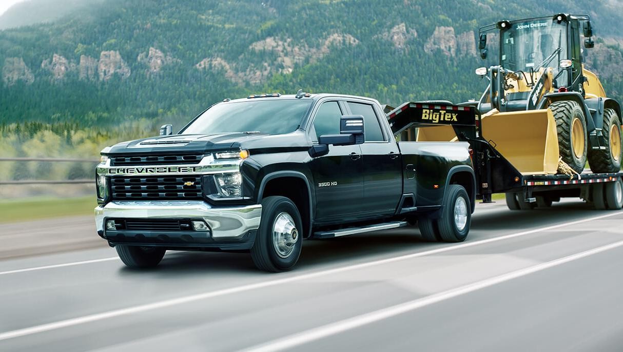 2021 Chevy Silverado 3500HD towing a truck.