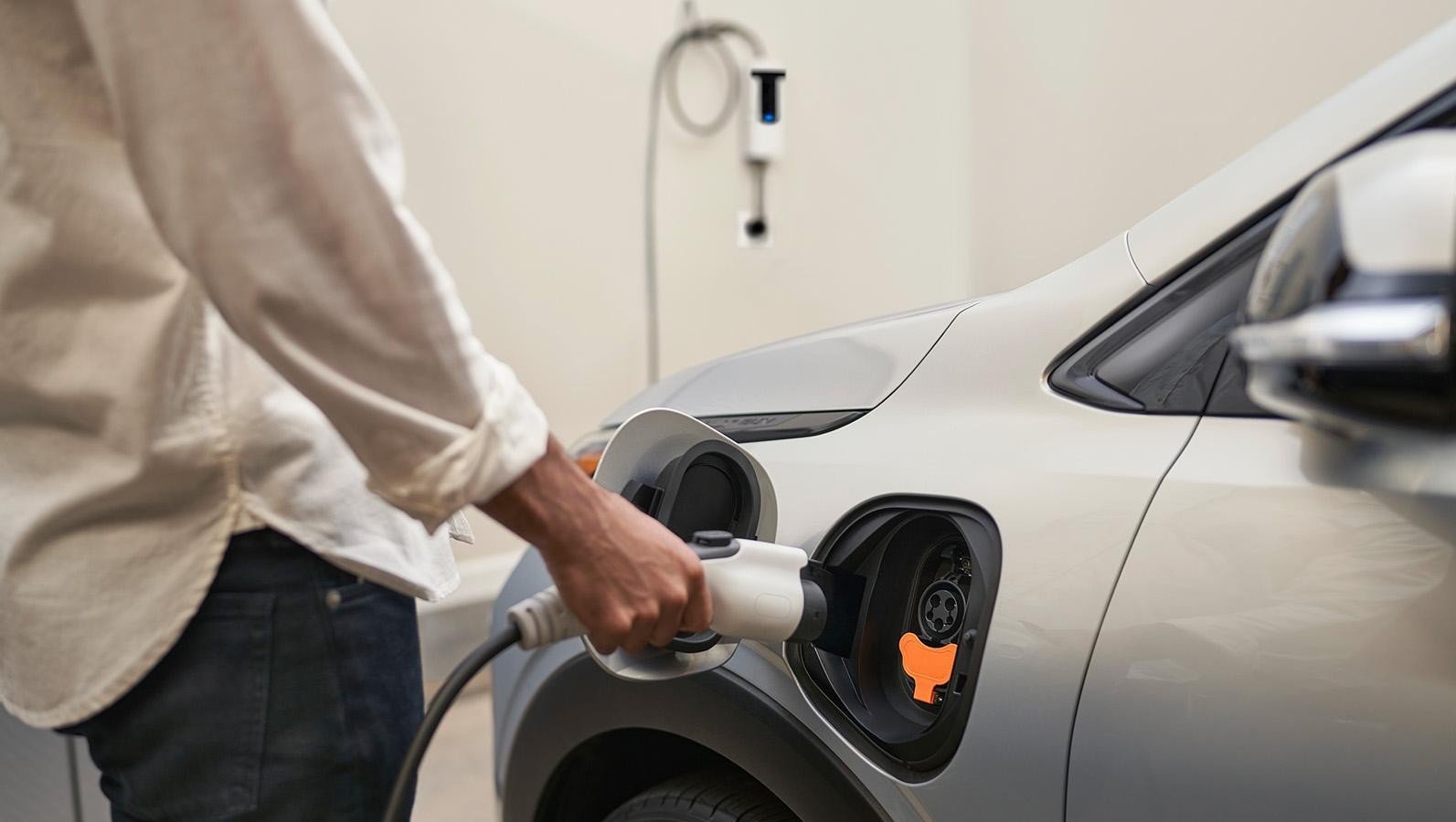 Person charging 2023 Chevrolet Bolt EUV