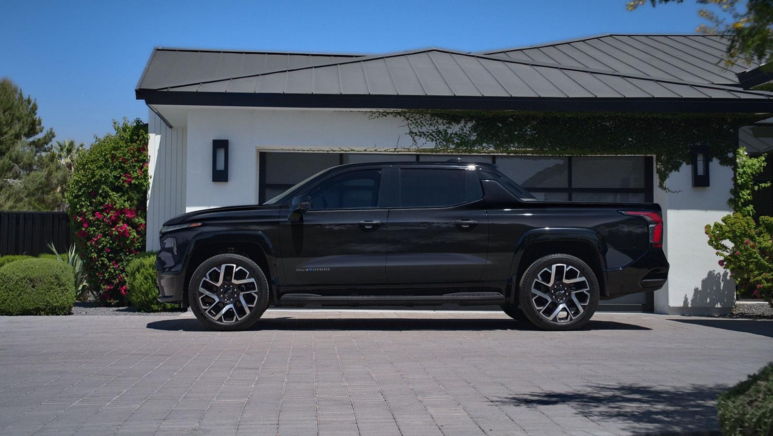 Black 2024 Silverado EV parked in a driveway