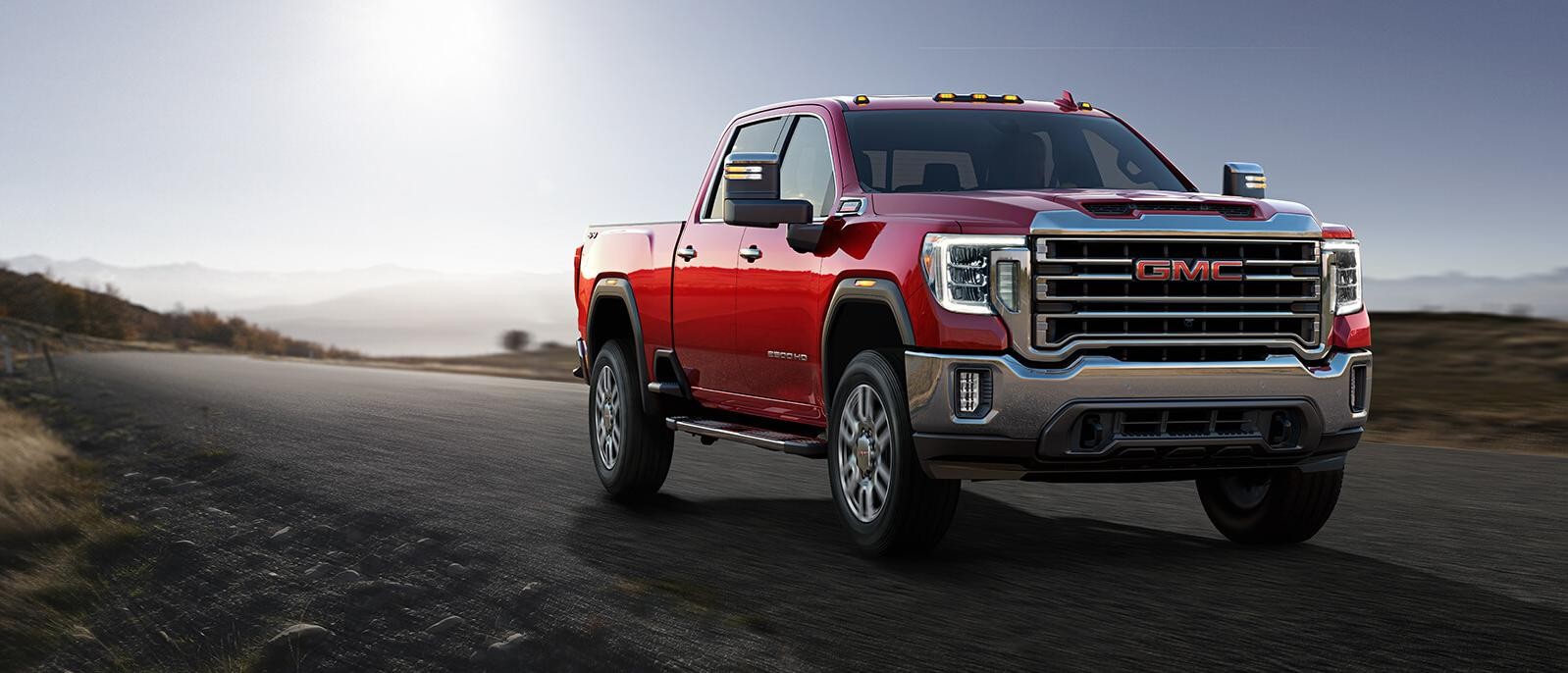 A 2021 GMC  Sierra 2500 riding on a road