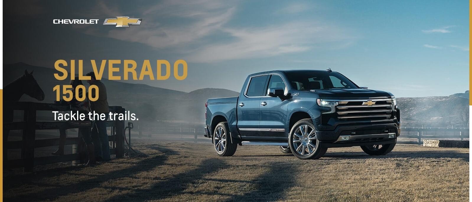 Black 2023 Silverado 1500 parked in open space with mountains in background 