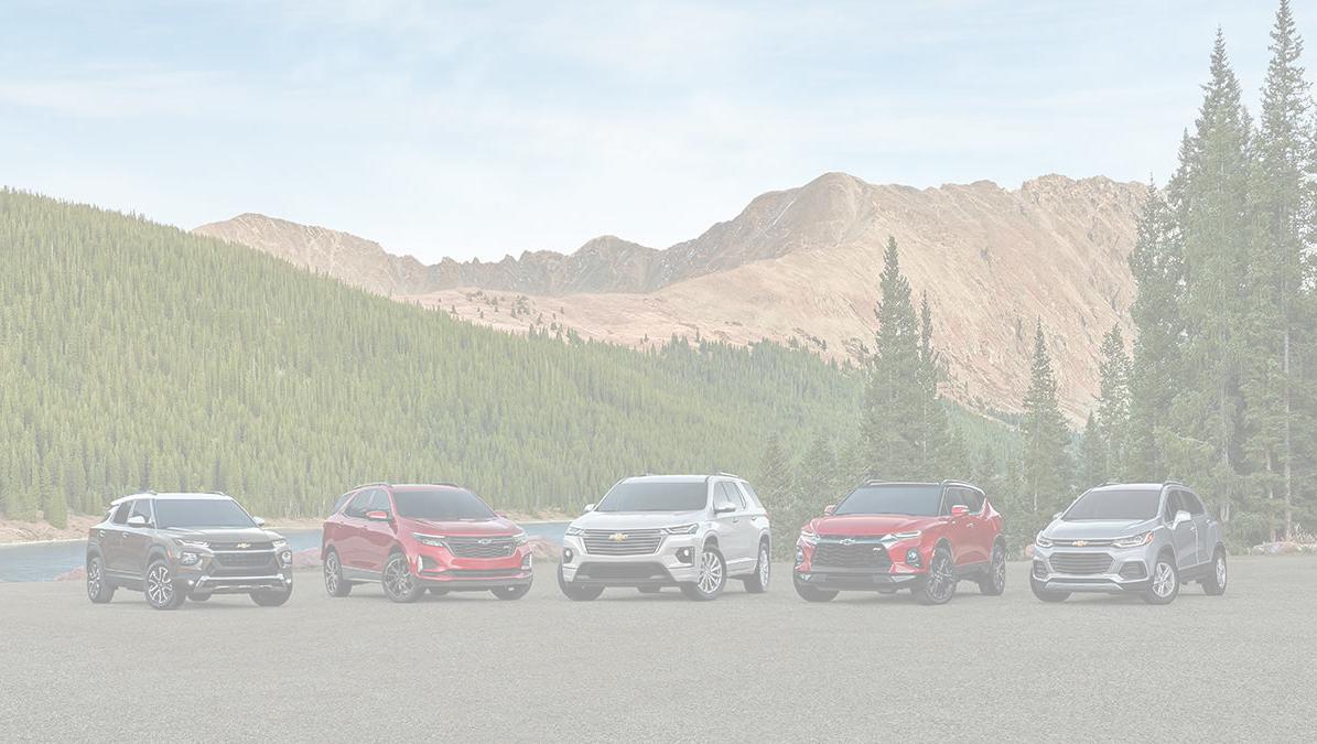 Lineup of Chevrolet Trailblazer, Equinox, Traverse, Blazer, and Trax in a mountainous viewpoint.