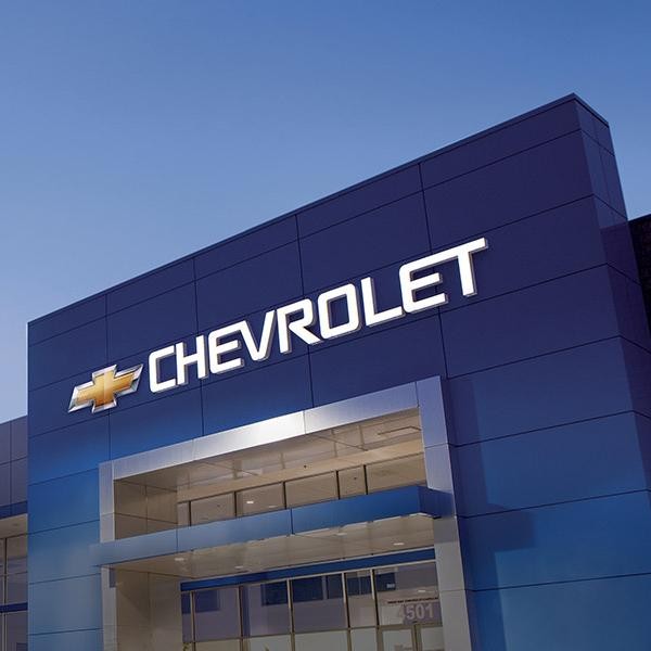 A Chevrolet dealership at sunset.