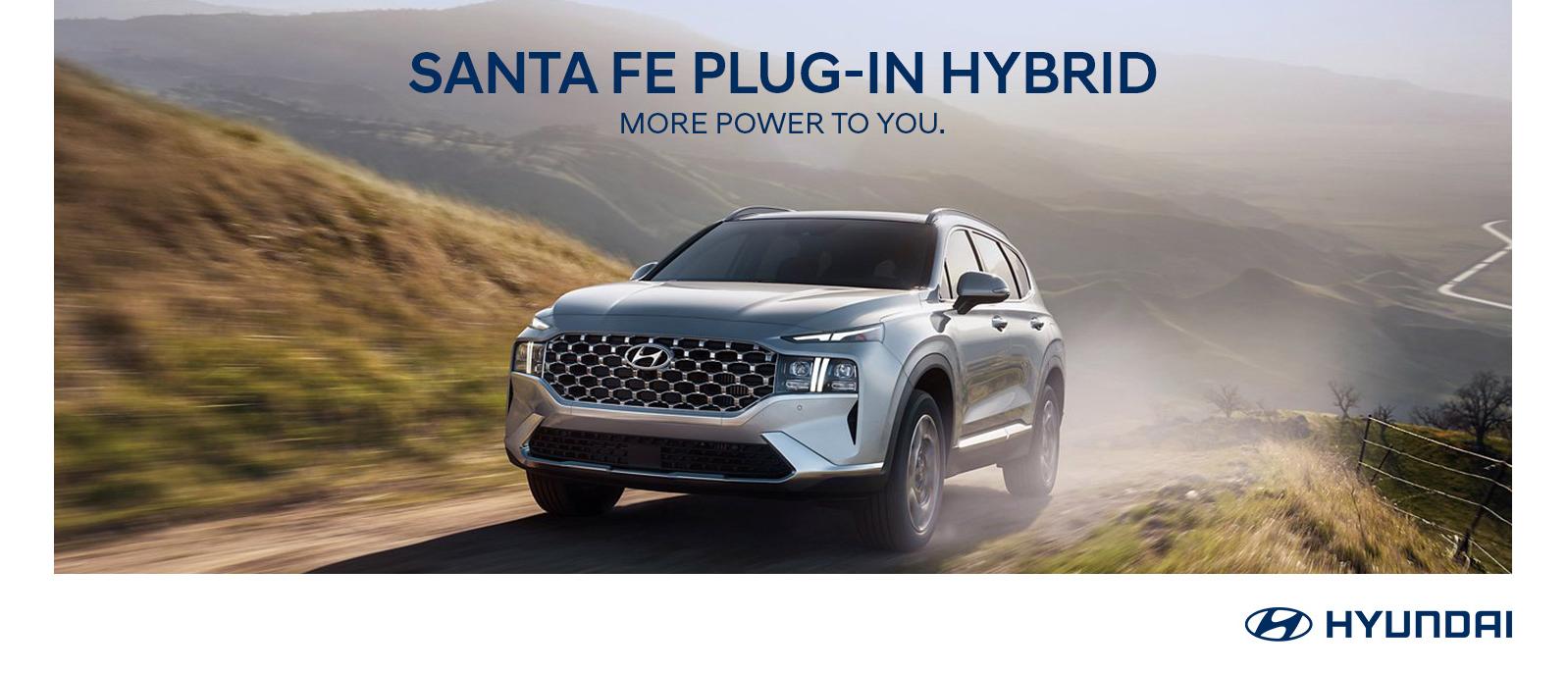 Grey 2022 Hyundai Santa Fe Plug-In Hybrid⁠ running on the mountain road.