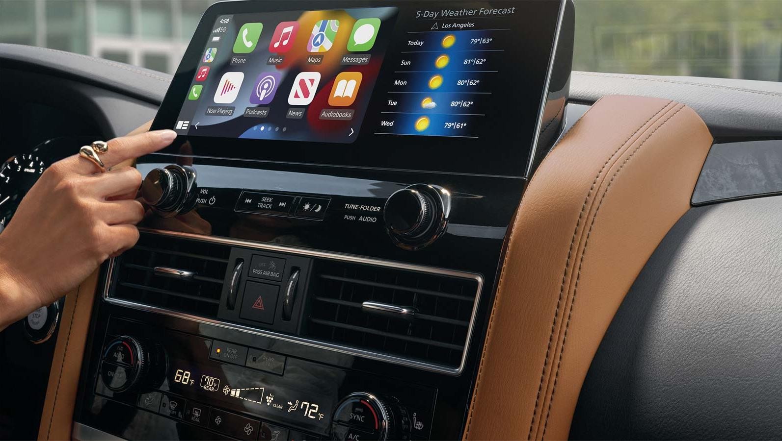 Interior of Electronic Dashboard and woman using it on Infiniti QX80