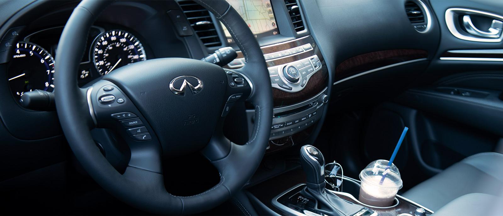 Interior view of an INFINITI QX60 from the driver's point of view.
