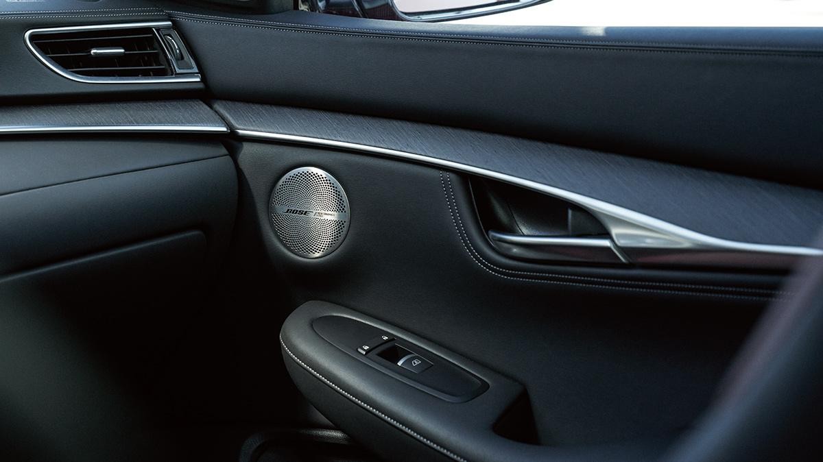 Close-up view of the interior door handle of an INFINITI QX55.