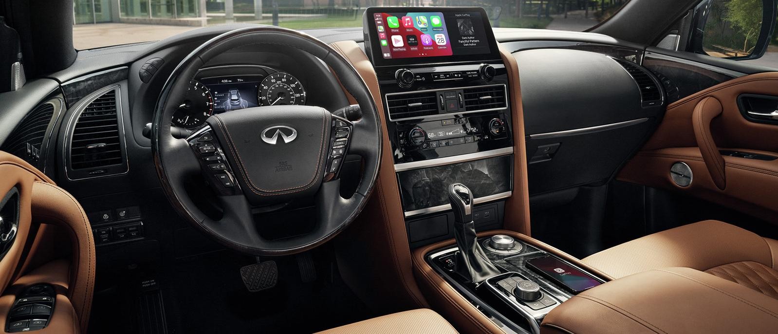 Interior view of an INFINITI QX80 front seat cockpit.