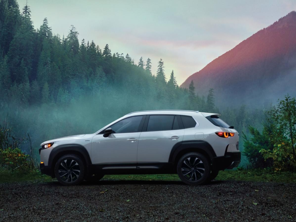 White 2025 Mazda CX-50 Hybrid parked in the mountains