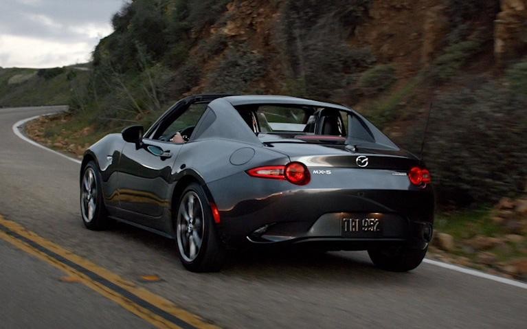 Mazda MX-5 Miata cruising on road