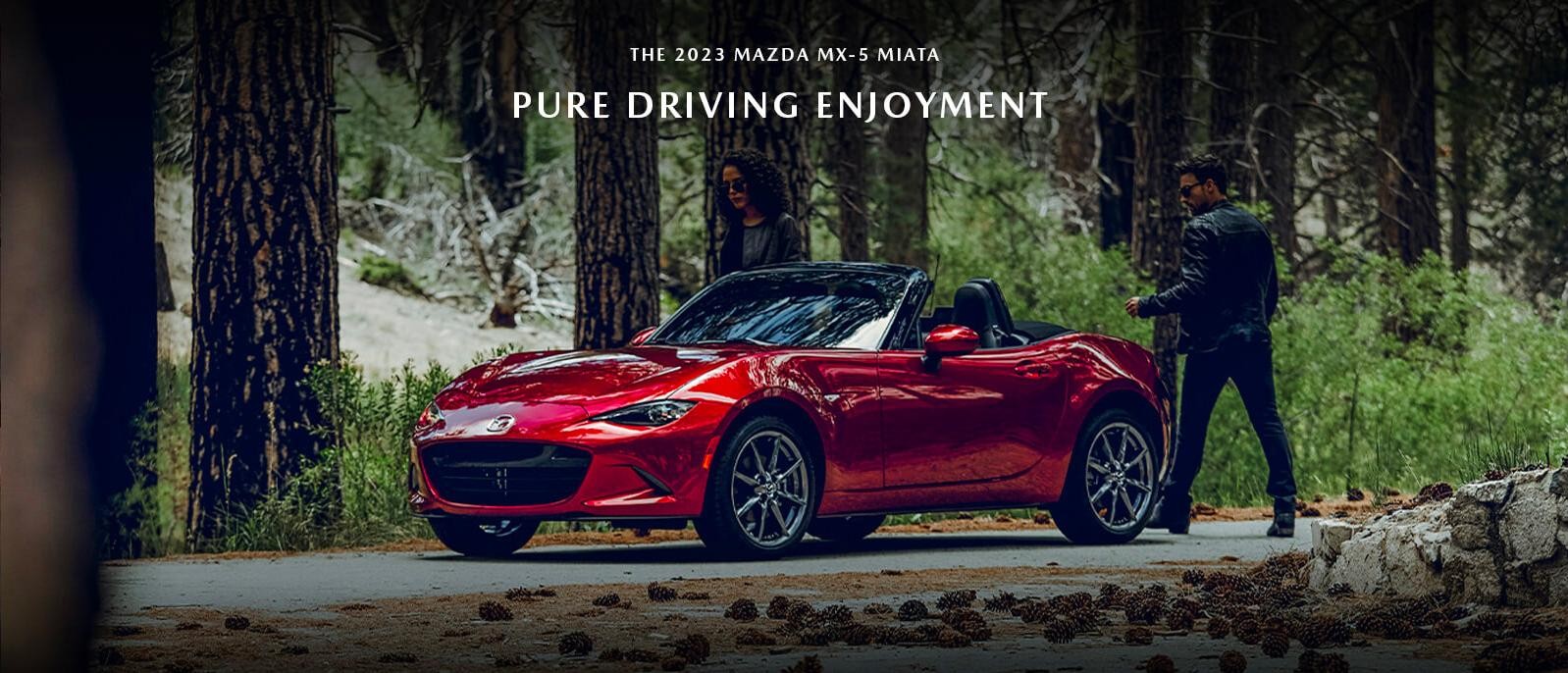 Couple getting into 2023 Mazda MX-5 Miata