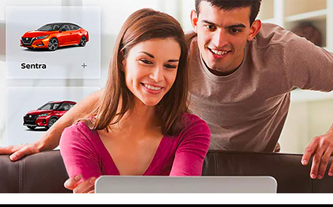 A couple shopping Nissan vehicle online.