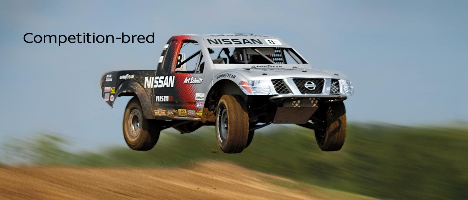 2023 Nissan Frontier off-road and airborne competing in a race.jpg