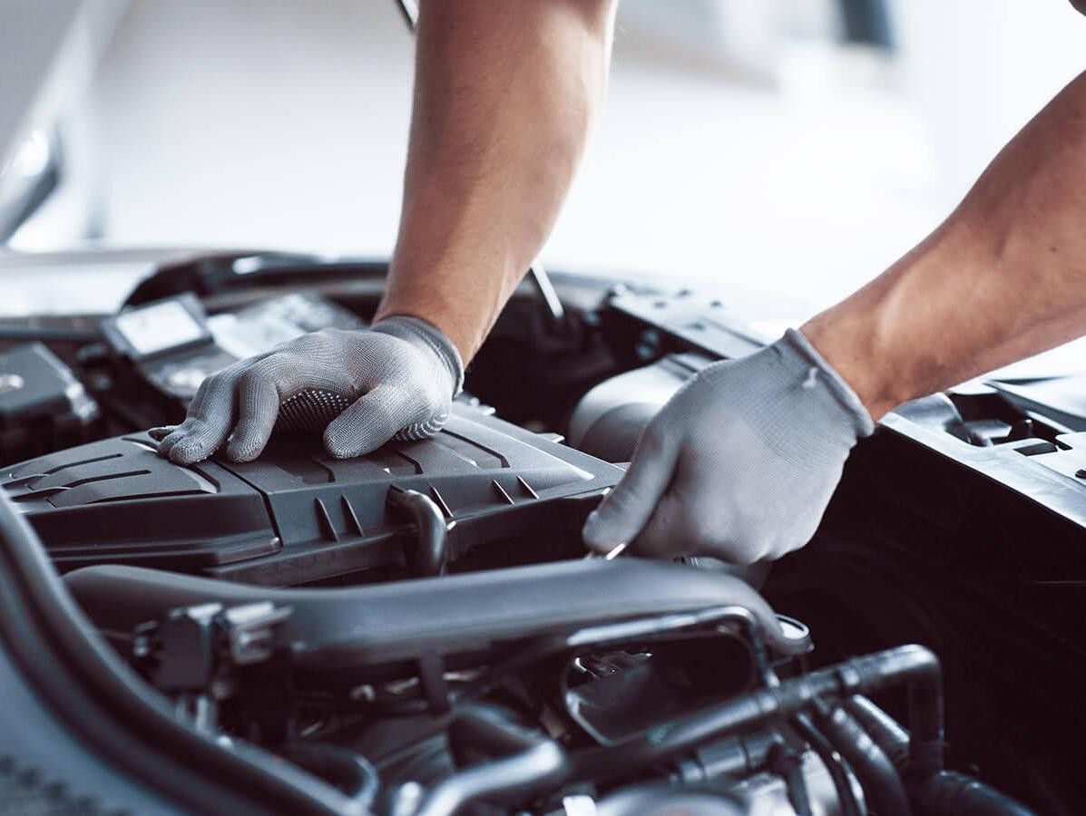 Service technician working on a vehicles