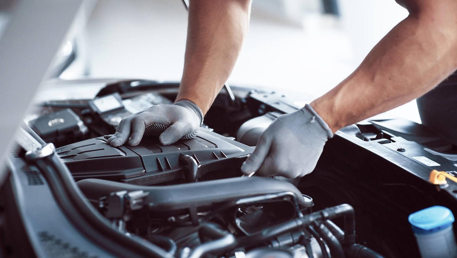 Service technician working on a vehicles