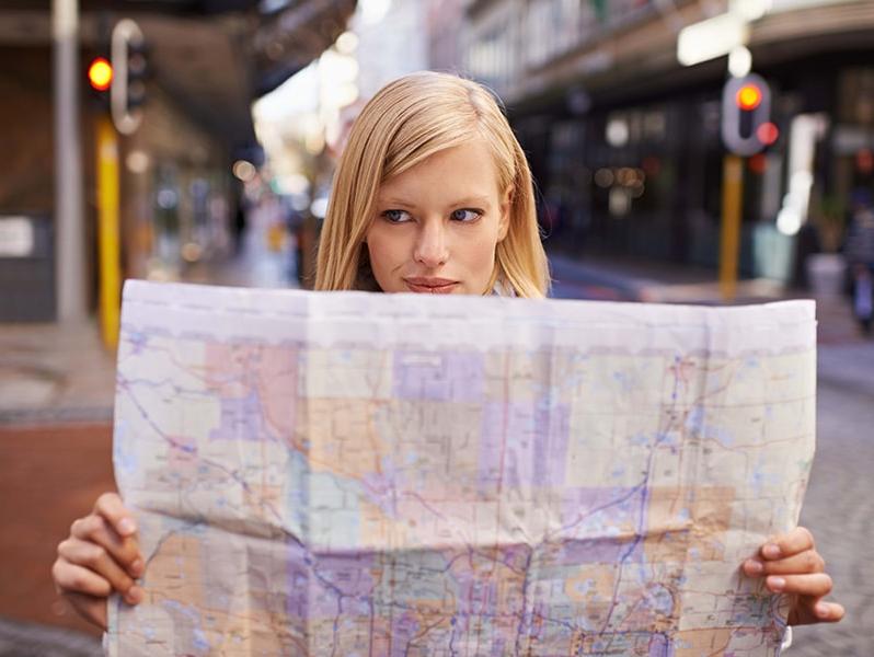 Girl looking at a road map