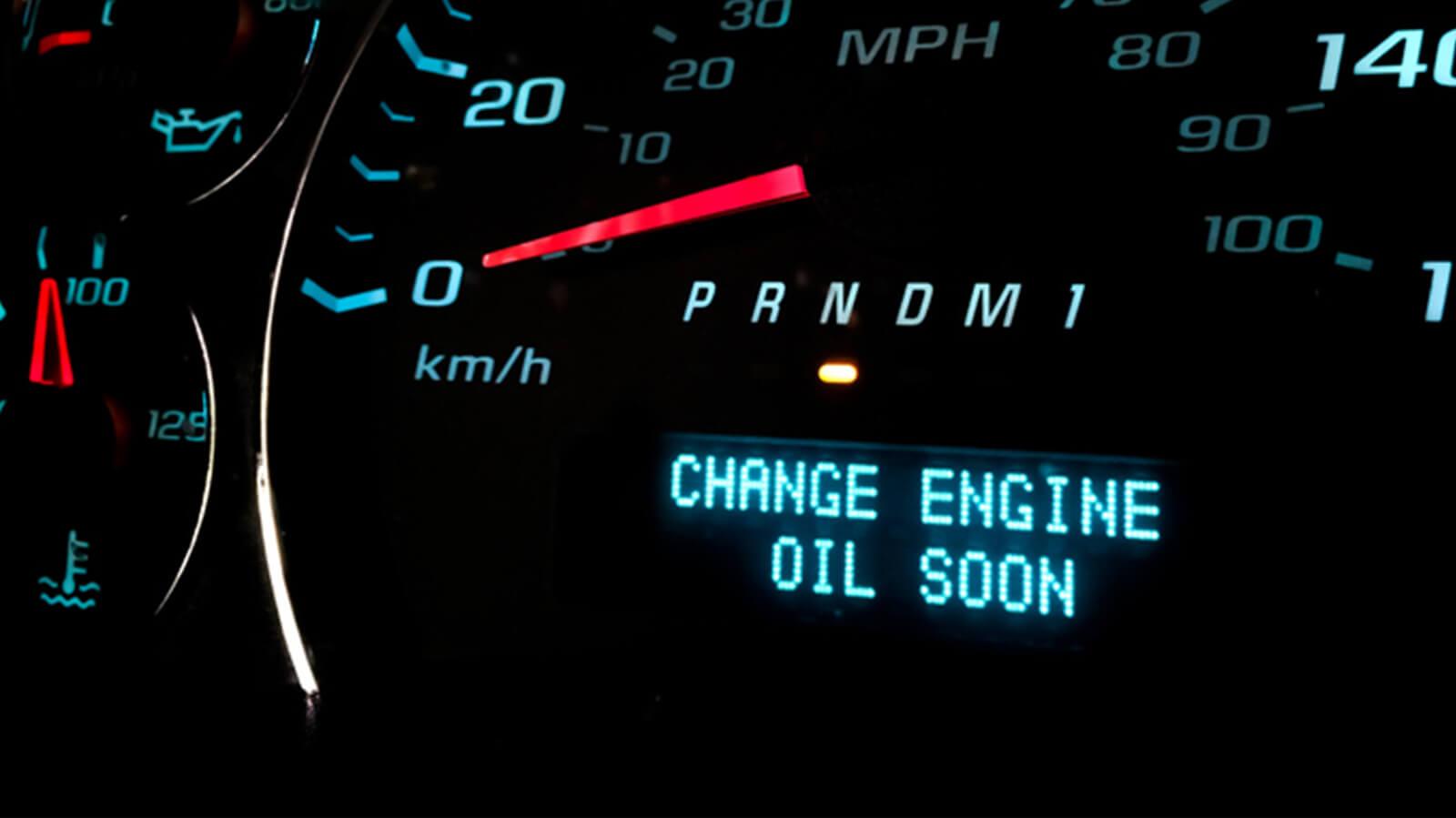 Vehicle dashboard showing the change engine oil warning