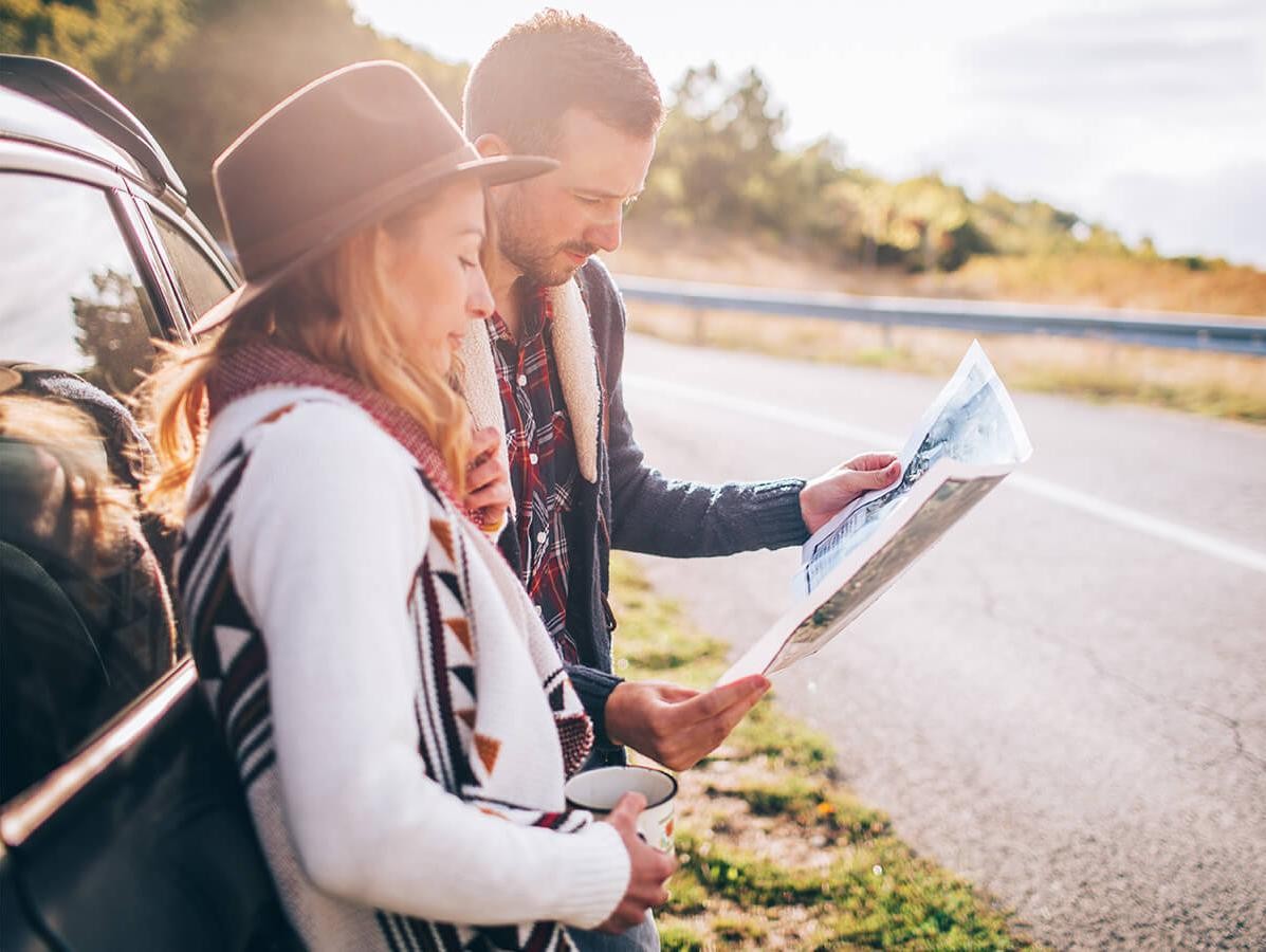 Young couple looking at a road map