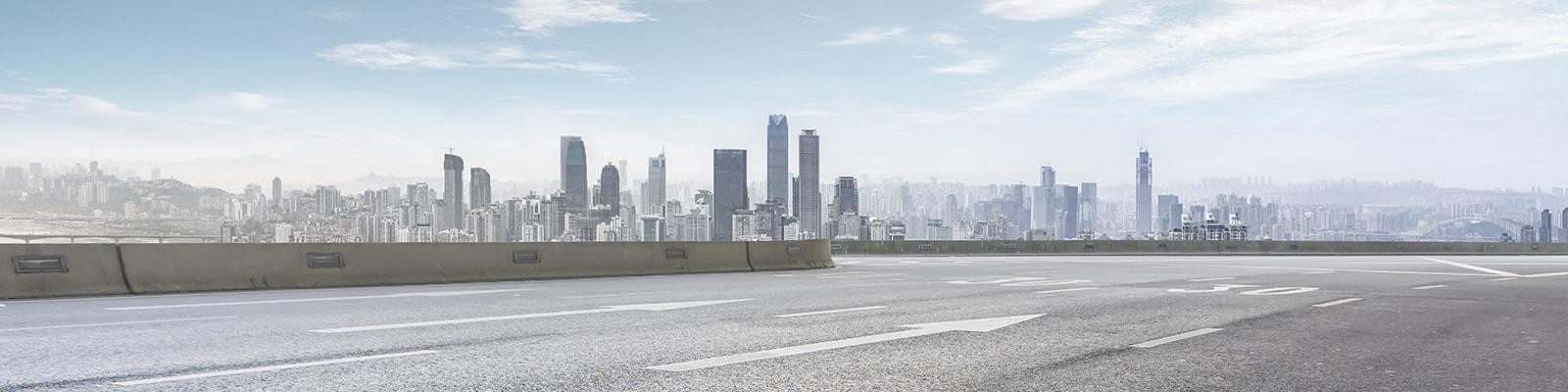 Highway with a city skyline in view