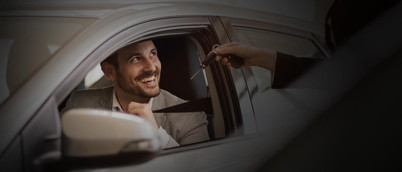 Elegant salesperson working at car dealership